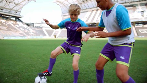 Player learning how to shield a soccer ball